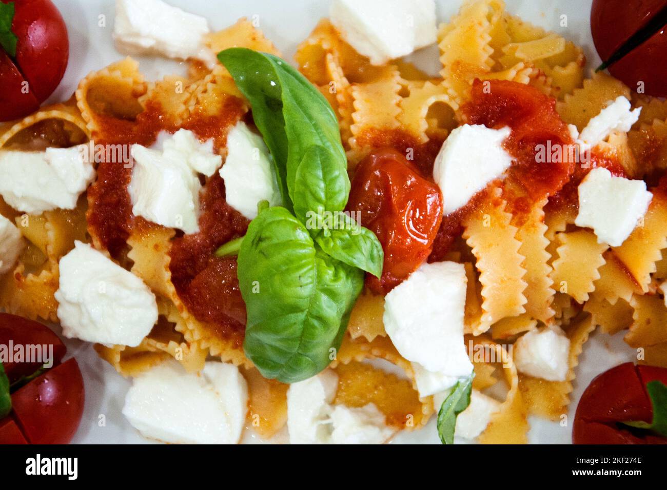 Tagliatelle alla sorrentina made with cherry tomato, mozzarella, basil and white onion, made by the chef of the city of Maddaloni (CE) Giovanna Esposi Stock Photo