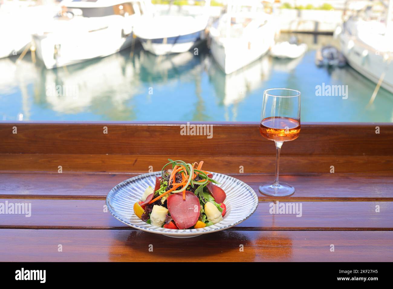 Seasonal Salad with Homemade Pastrami or bacon. With blush or rose wine