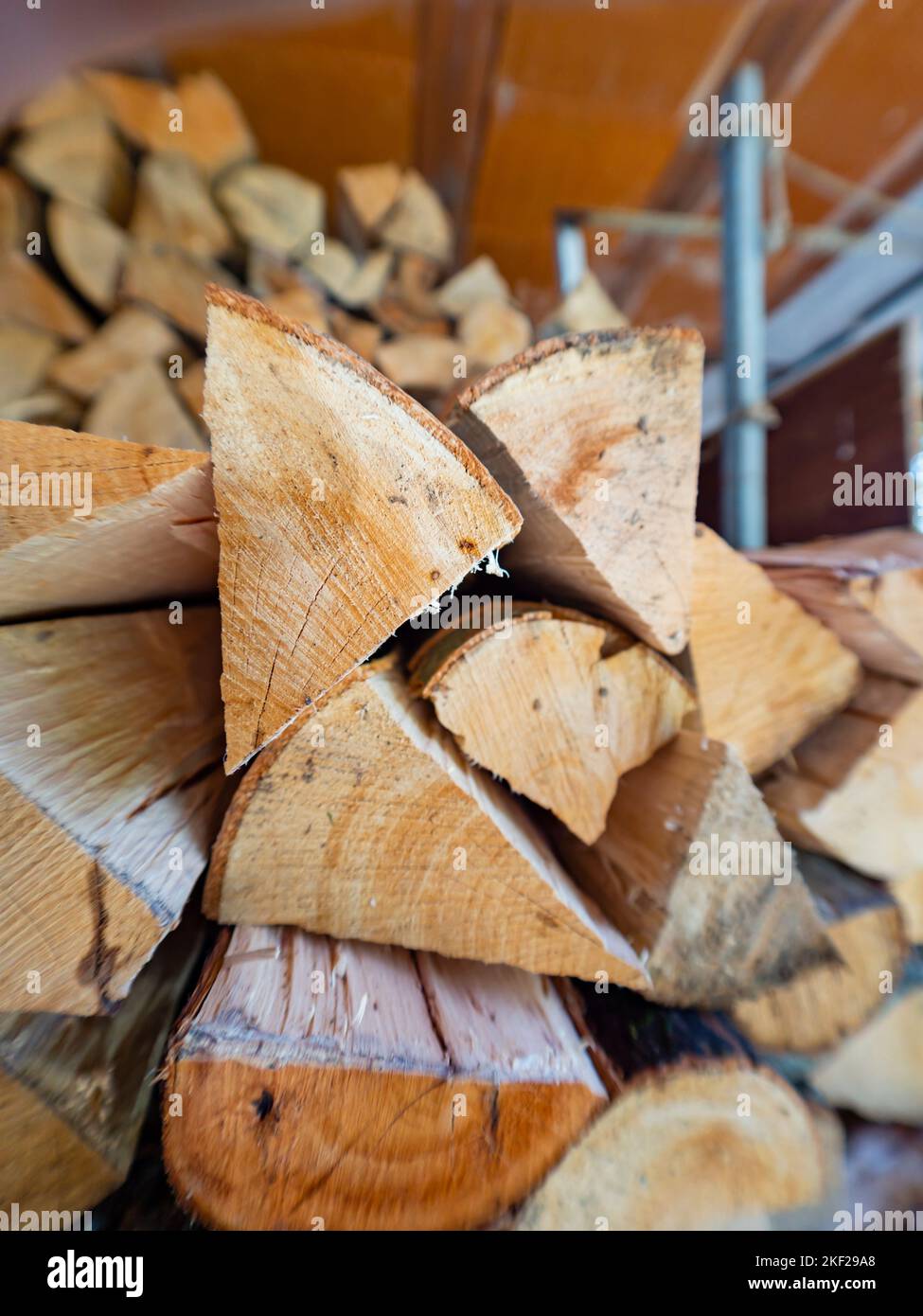 Piled wooden logs partitioned small parts cut Stock Photo