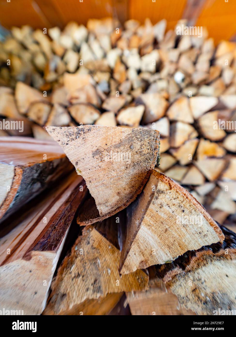 Piled wooden logs partitioned small parts cut Stock Photo