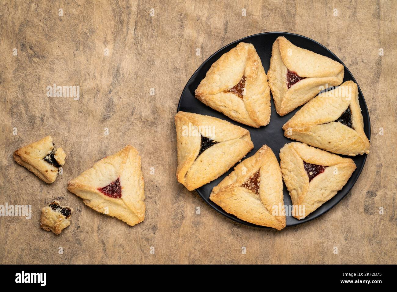 hamantaschen pastry with apricot, raspberry and prune filling on a
