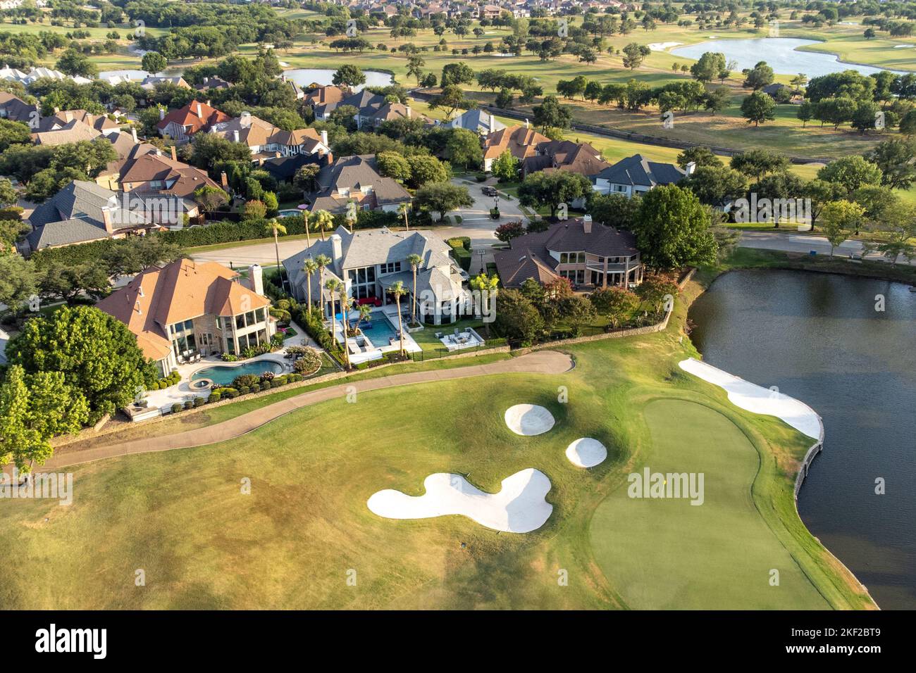 Aerial overview of luxury villas with swimming pools located around