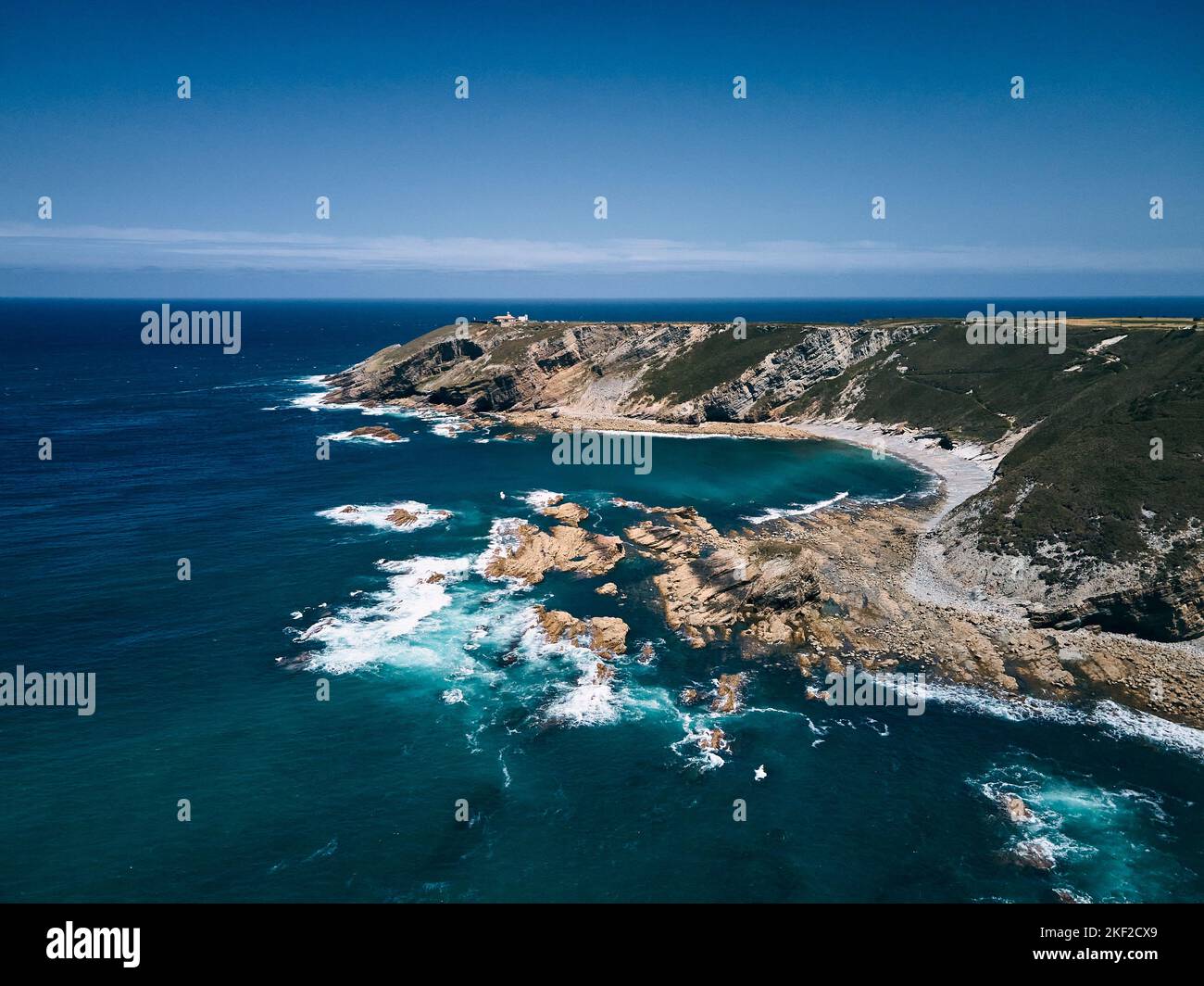view from a drone of the impressive rocks of the cliffs of the cantabrian sea near the cabo de vidio lighthouse, asturias, spain Stock Photo