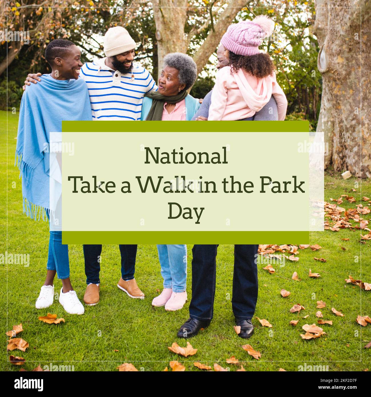 Composition of national take a walk in the park day text and family in park Stock Photo Alamy