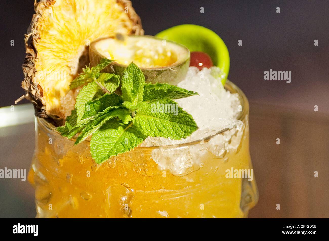 Yellow cocktail with dry pineapple and mint Stock Photo