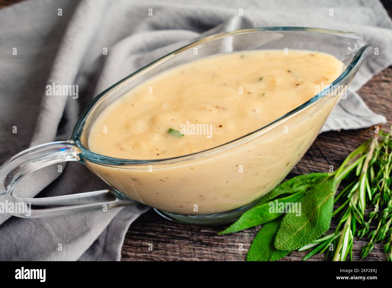 Classic Southern Gravy Made with Fresh Herbs in a Gravy Boat Homemade