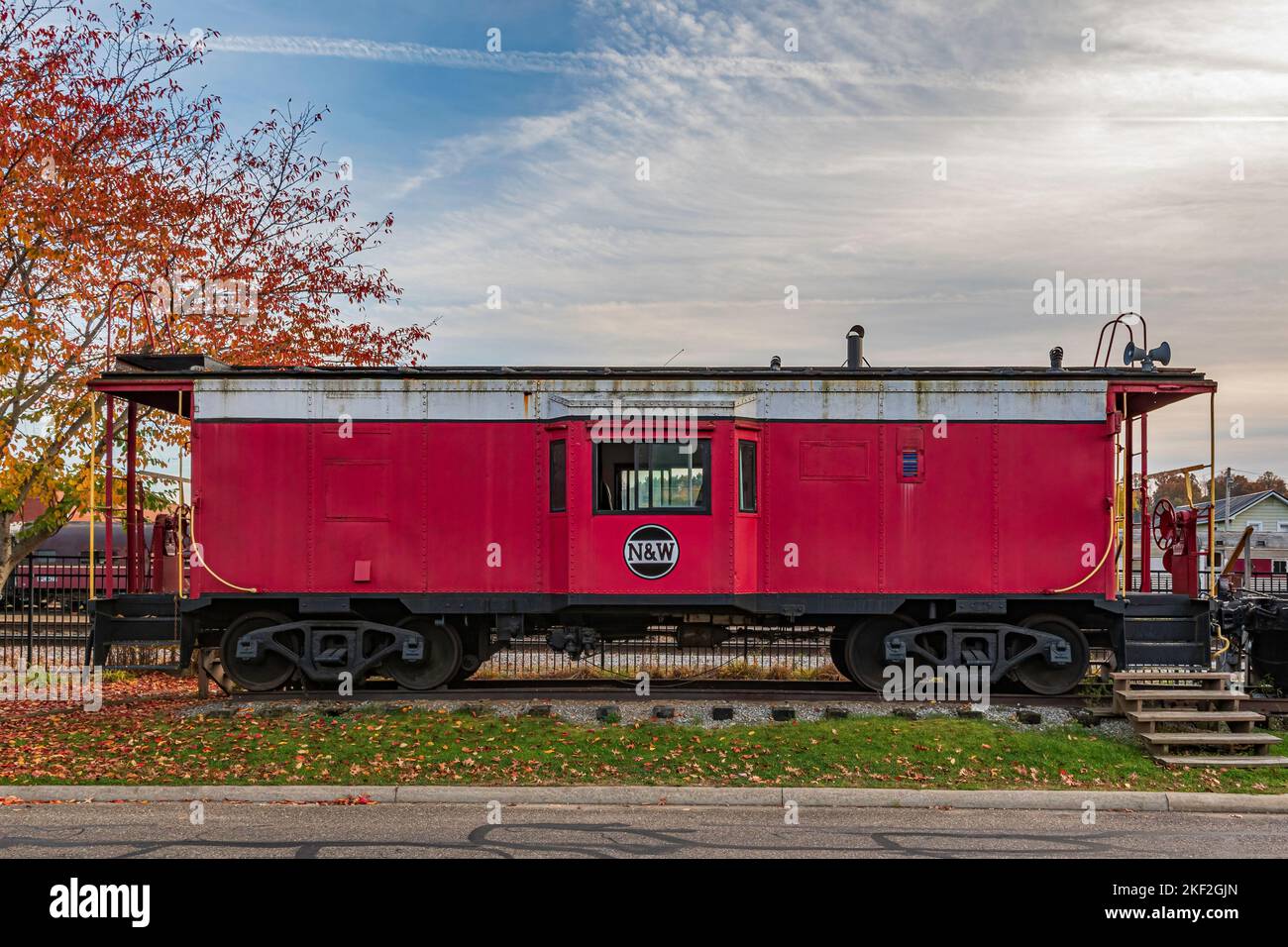 Dennison, Ohio, USA- Oct. 24, 2022: Caboose railcar on dispaly at the Dennison Railroad Depot Museum on an autumn day. Stock Photo