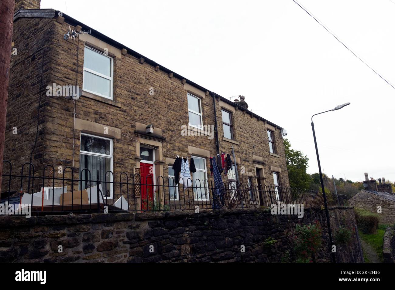 Washing hanging outside the house in a street in New Mills, Derbyshire