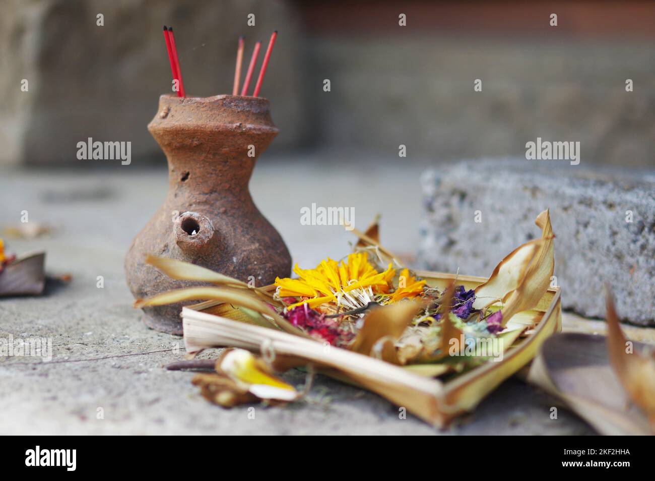 Offering of flowers and incense sticks at Pura Tirta Empul, the Hindu