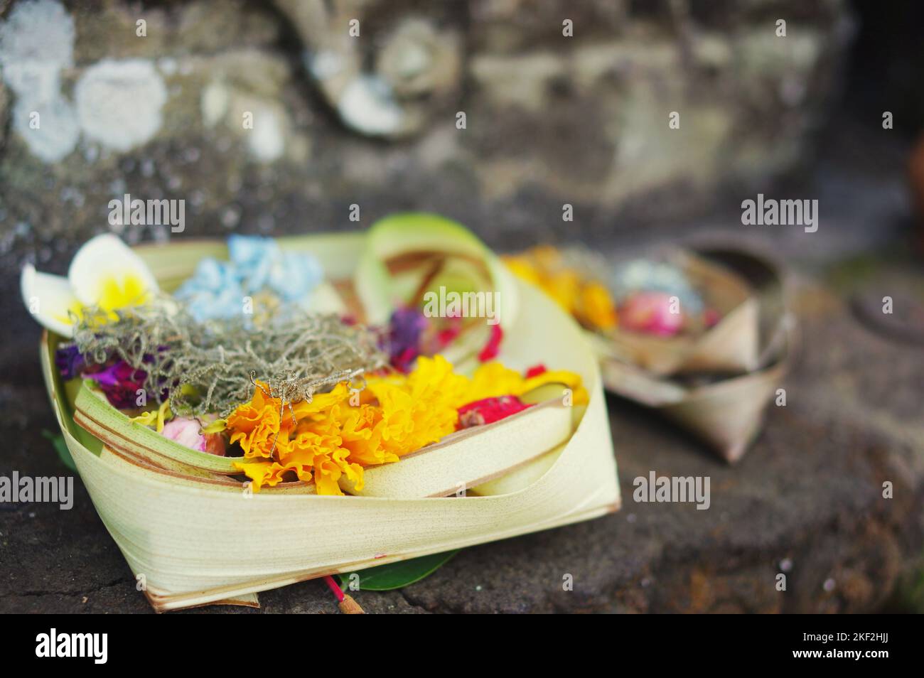 Offering of flowers and incense sticks at Pura Tirta Empul, the Hindu