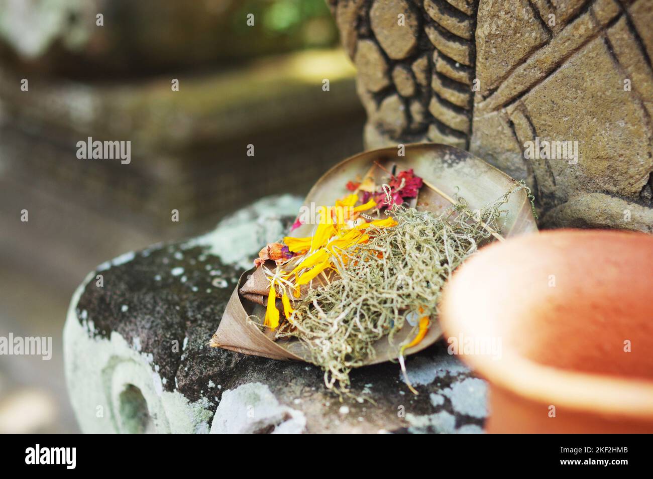 Offering of flowers and incense sticks at Pura Tirta Empul, the Hindu
