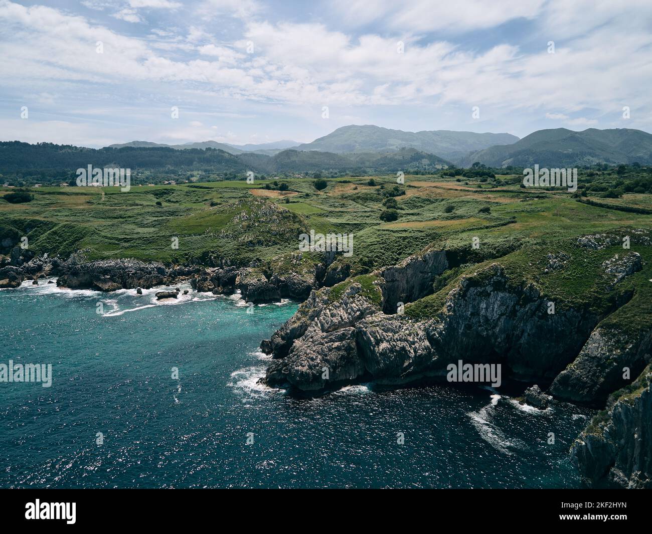 beautiful drone view cliffs of the steep coastline with many rocks next ...