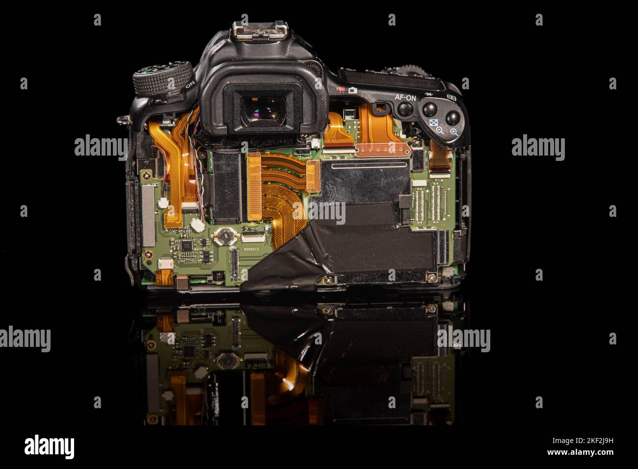 A Canon 70D DSLR with the back removal showing the internals of the camera Stock Photo