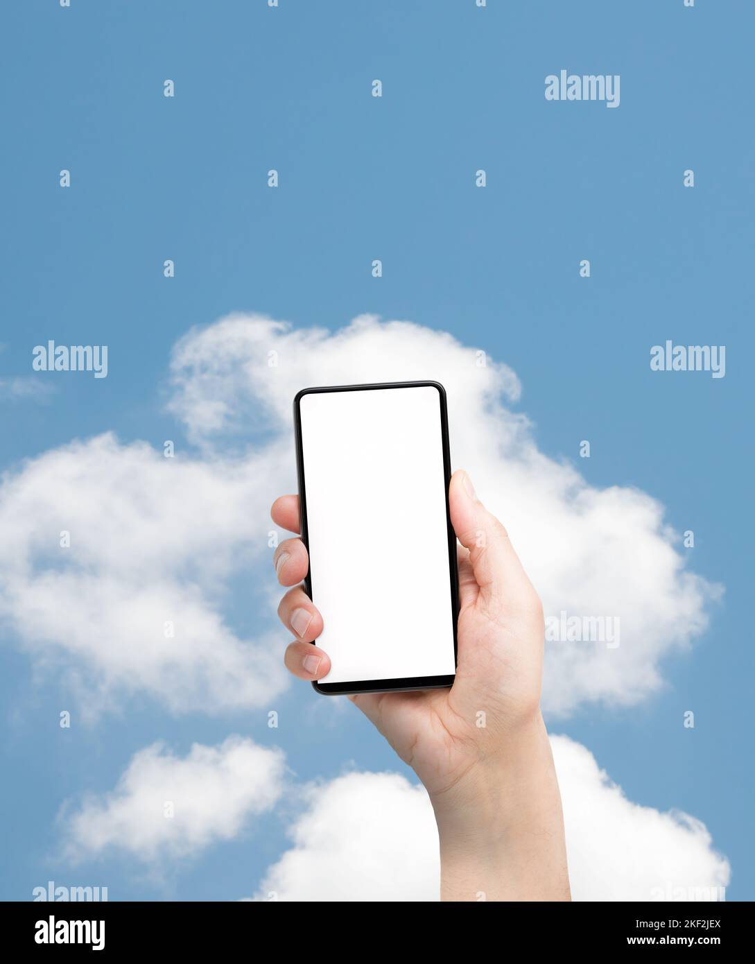 Man hand presenting a smartphone screen application over isolated cloud background.Online cloud communication concept Stock Photo