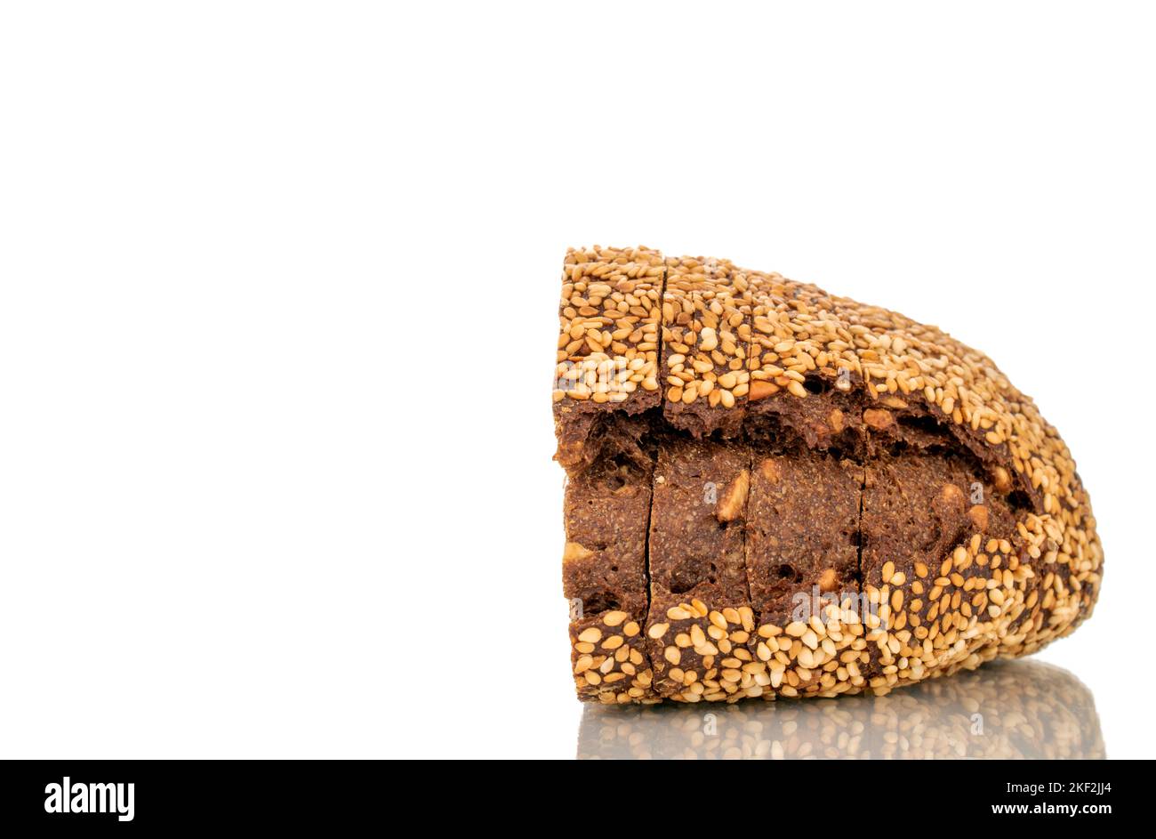 One half of rye multigrain bread, macro, isolated on white background