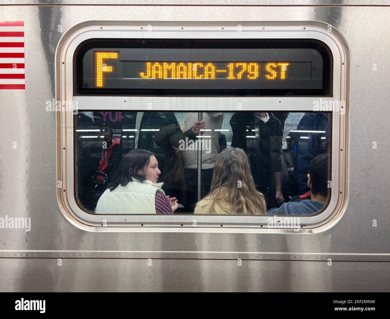 F train to Jamaica, Queens in the station at 42nd Street, New York City. Stock Photo