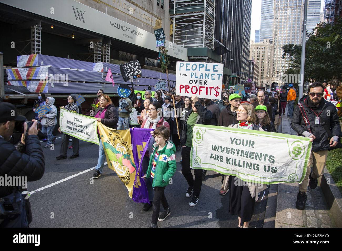 Extinction Rebellion and other groups march along Park Avenue stopping at J.P.Morgan Chase, Black Rock and other huge investment firms telling them to stop investing in fossil fuels and replace greed with care for the future of humanity and stop the growing climate catastrophe. Stock Photo