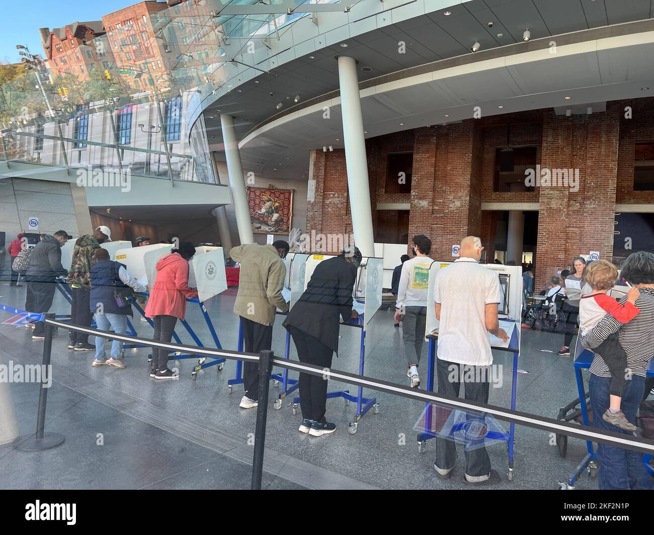 People early voting in the 2022 midterm elections in the outer lobby of the Brooklyn Museum in Brooklyn, New York. Stock Photo