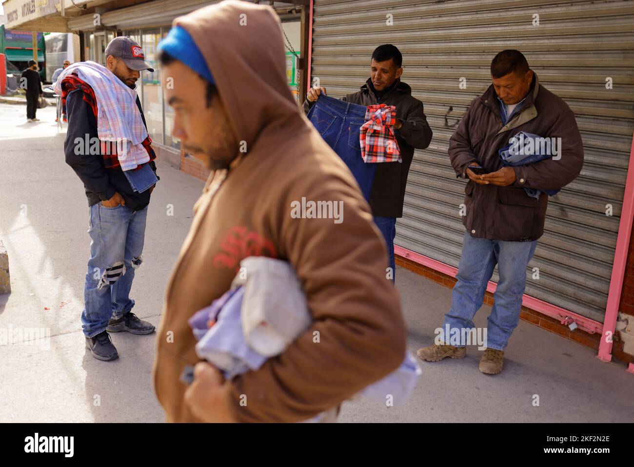 Venezuelan migrants carry their clothes after visiting the "Gratis