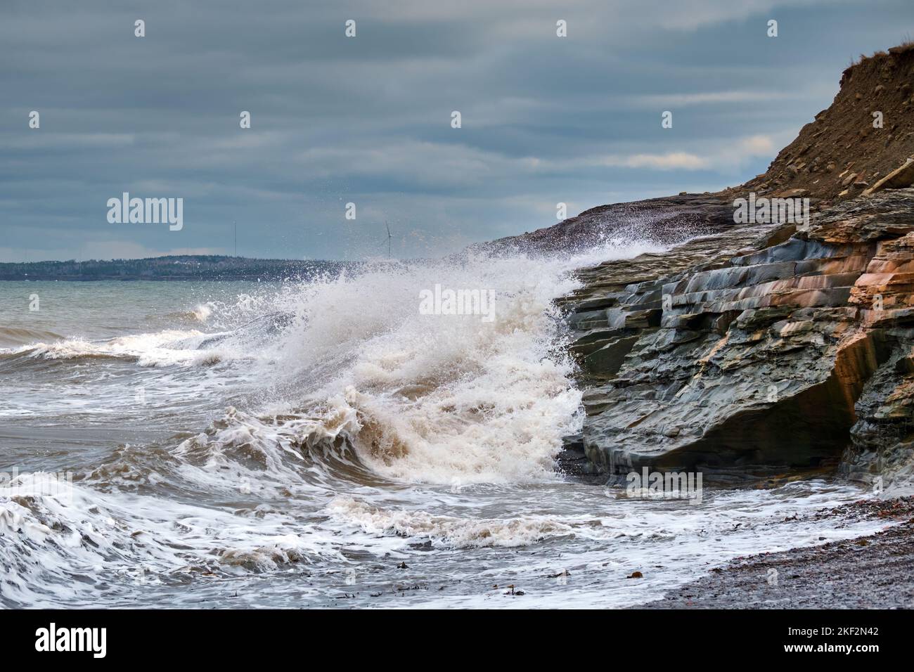 Dramatic waves battter the cliffs at Table Head Beach in Glace Bay Cape
