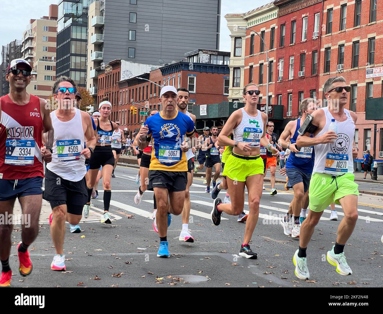 2022 TCS New York City Marathon runners cruise up 4th Avenue through Park Slope Brooklyn during