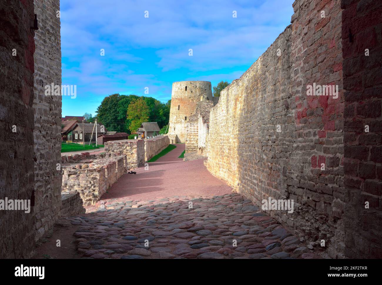 The old stone Izborskaya fortress. Defensive corridor at the fortress walls, an architectural monument of the XIV-XVII century. Izborsk, Pskov region, Stock Photo
