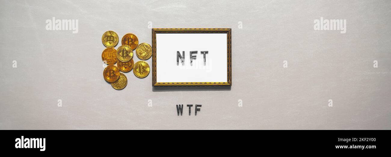 NFT cryto digital art text in golden frame and crytocurrency on silver banner background. NFT WTF collapse, crash and confusion concept Stock Photo
