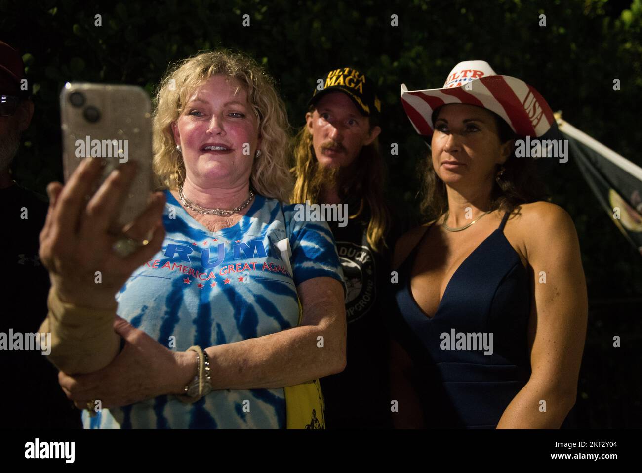 West Palm Beach, Florida, USA. 15th Nov, 2022. Supporters outside of Mar-A-Lago watch a live broadcast of Former President Donald J. Trump in anticipation of his announcement towards the 2024 election at Mar-a-Lago in West Palm Beach (Credit Image: © Orit Ben-Ezzer/ZUMA Press Wire) Credit: ZUMA Press, Inc./Alamy Live News Stock Photo