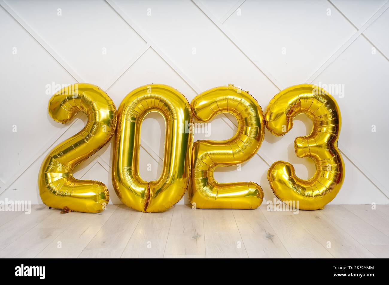 Banner with 2023 golden foil inflatable balloons. Christmas and 2023 New Year Holidays concept. Stock Photo