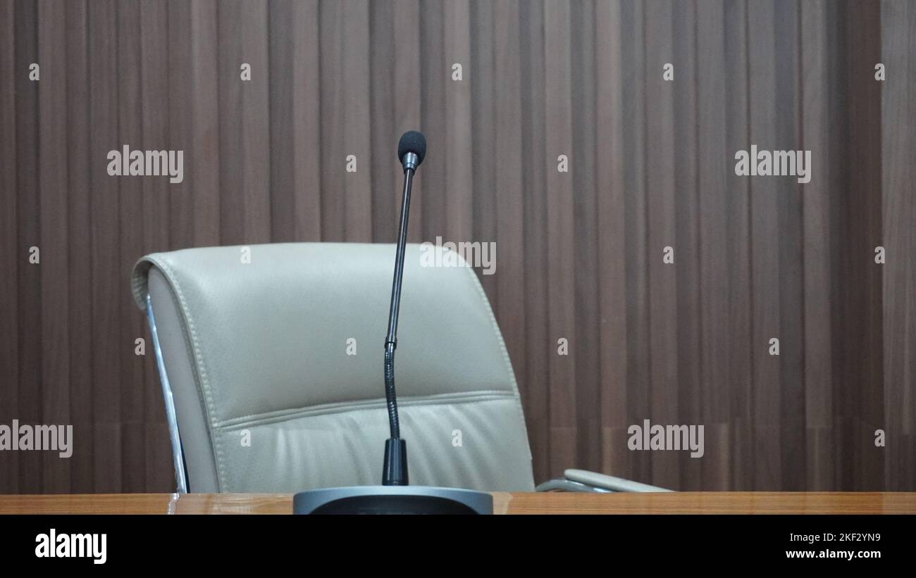 Interior table, chairs and microphone with coffee in the meeting room or work office Stock Photo