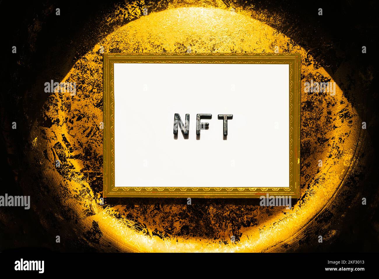 NFT digital crypto art text on white framed on gold background. Non-fungible token cryptocurrency Stock Photo