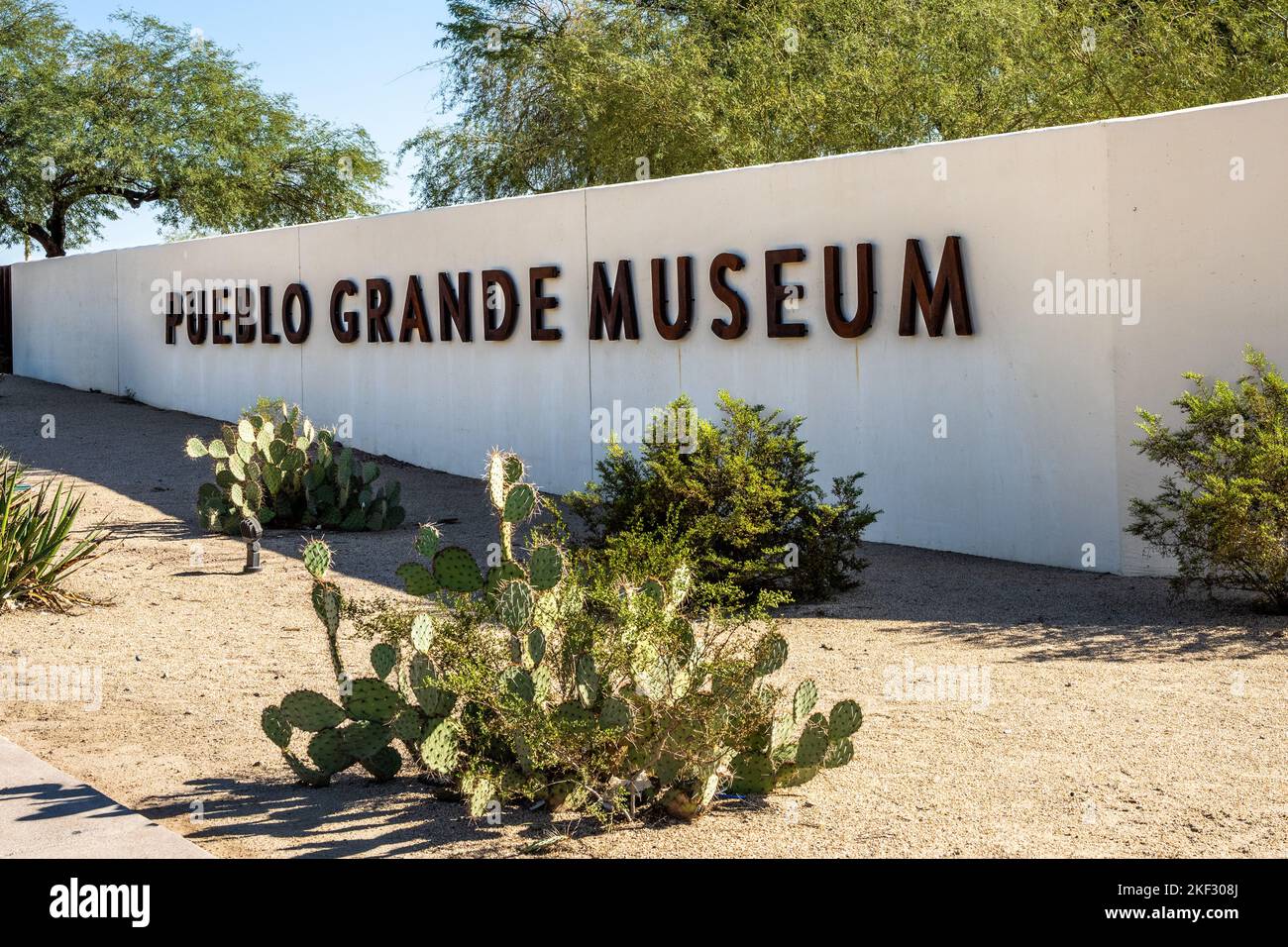 sign on the wall surrounding the Pueblo Grande Museum Archaeological Park Stock Photo