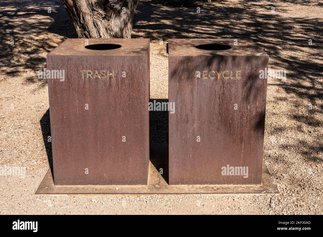 simple rusty metal trash and recycle bins in a southwest United States desert environment Stock Photo