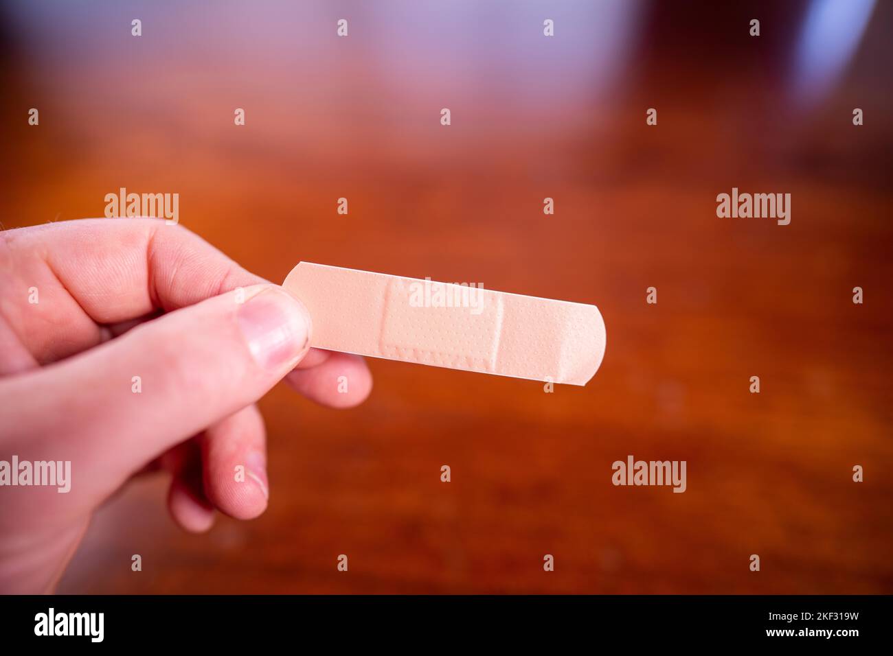 using a band aid on a hand in care Stock Photo Alamy
