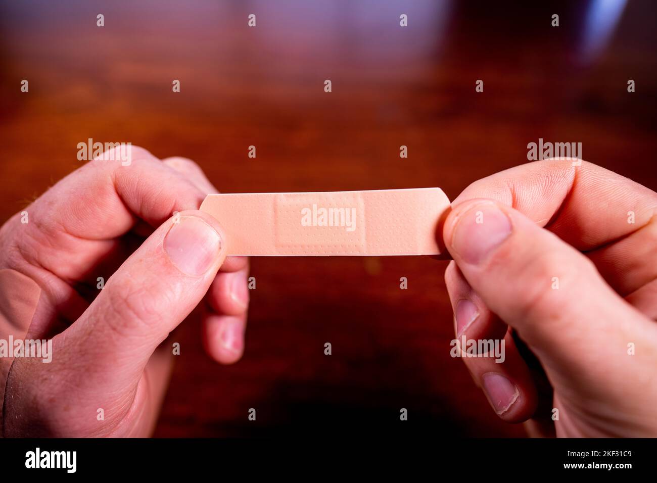 using a band aid on a hand in care Stock Photo Alamy