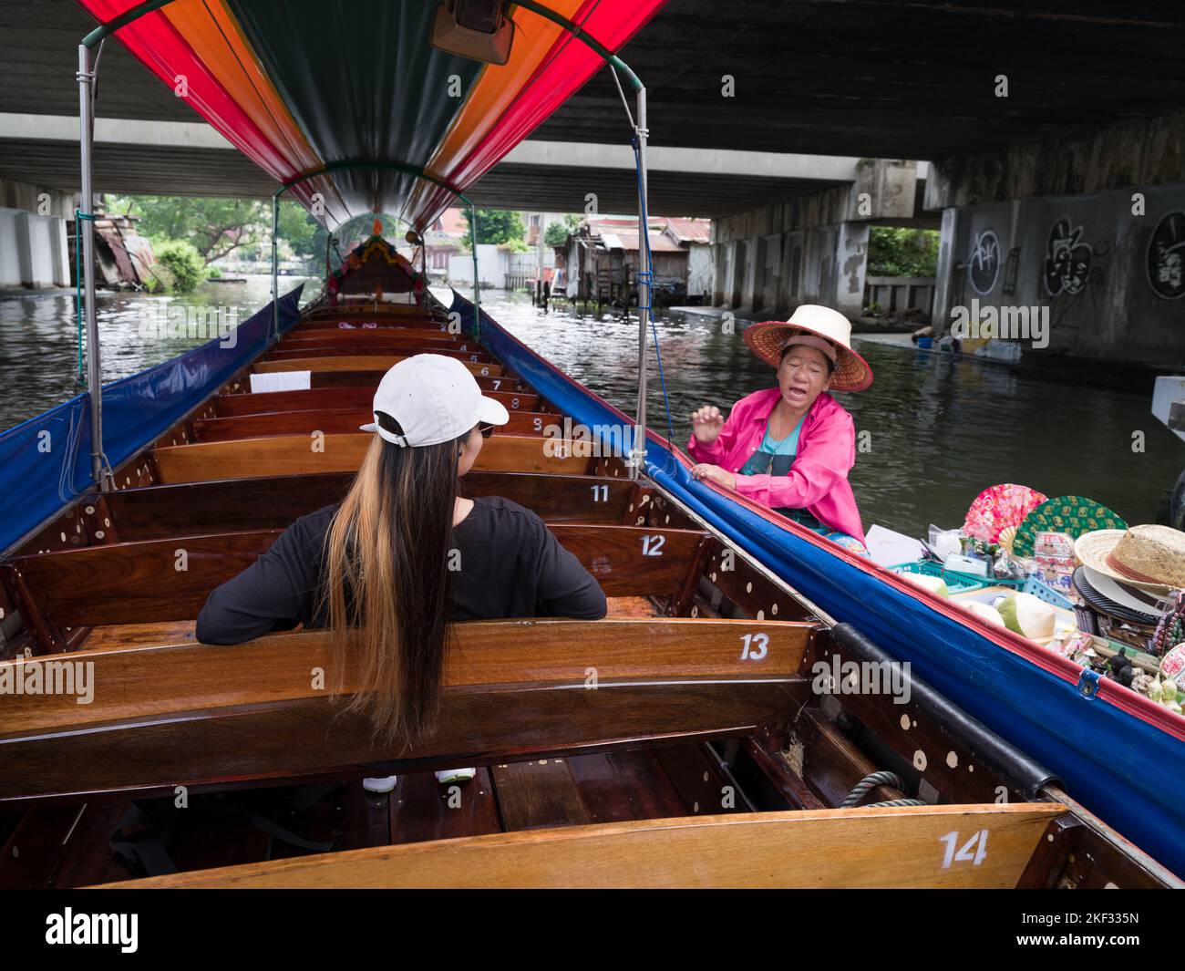 Bangkok, Thailand. November 4, 2022; Chao Phraya river cruise by traditional longboats. Shopping is done at the floating markets that dock to tourist Stock Photo