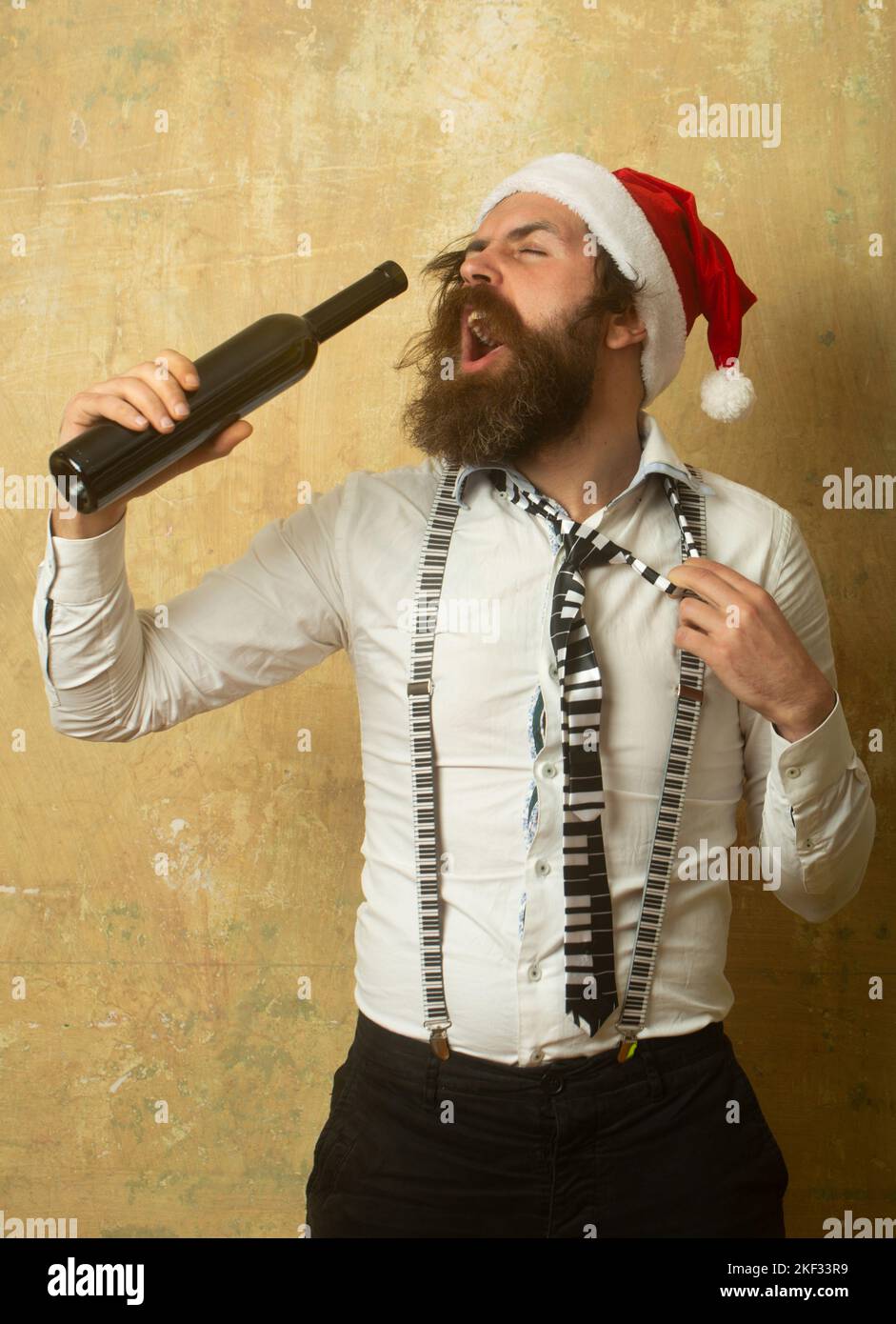 Alcoholic Santa Drinking a Wine Bottle. Drunk santa. Portrait of a