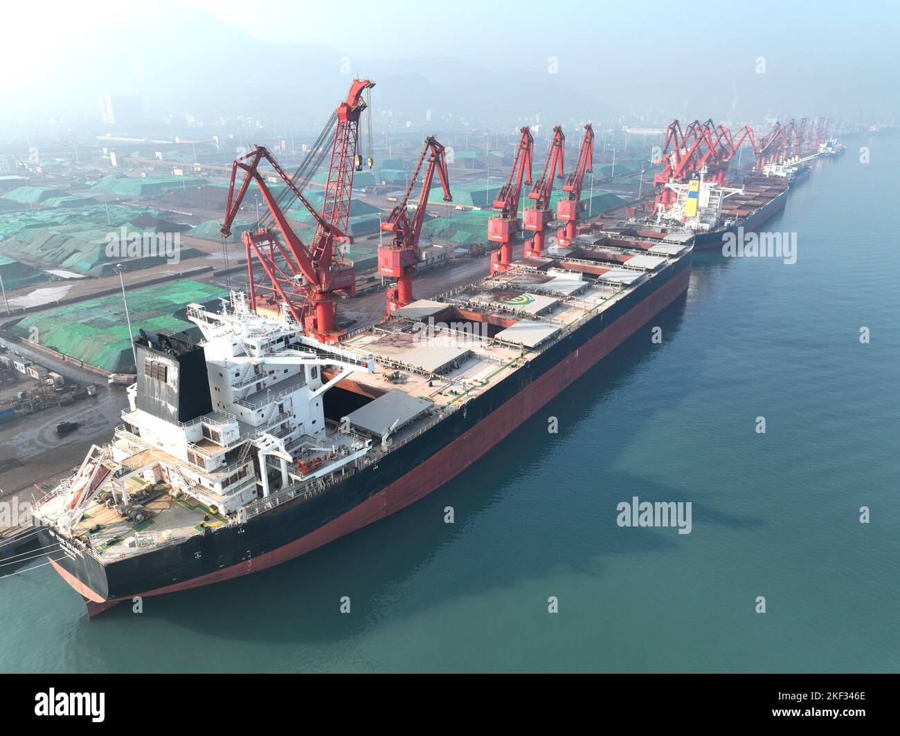 LIANYUNGANG, CHINA - NOVEMBER 16, 2022 - Cargo ships unload electric ...