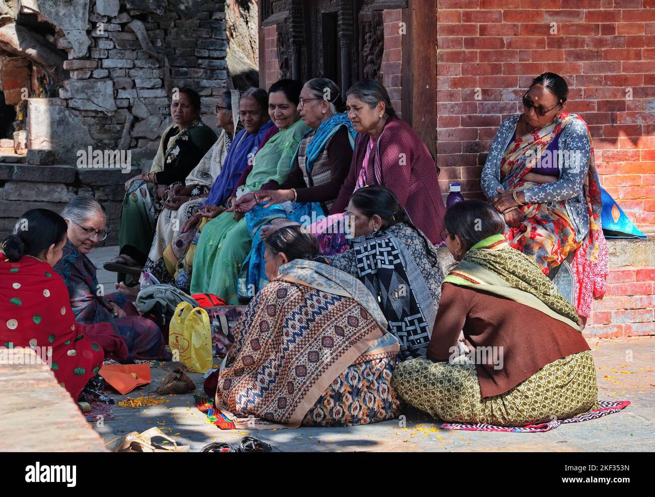 Group of Nepali women sitting in the shade and talking Stock Photo