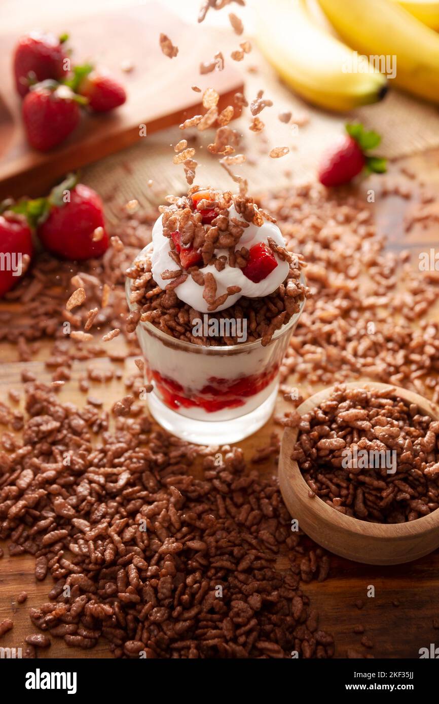 Healthy breakfast of Greek yogurt with fresh fruits and chocolate