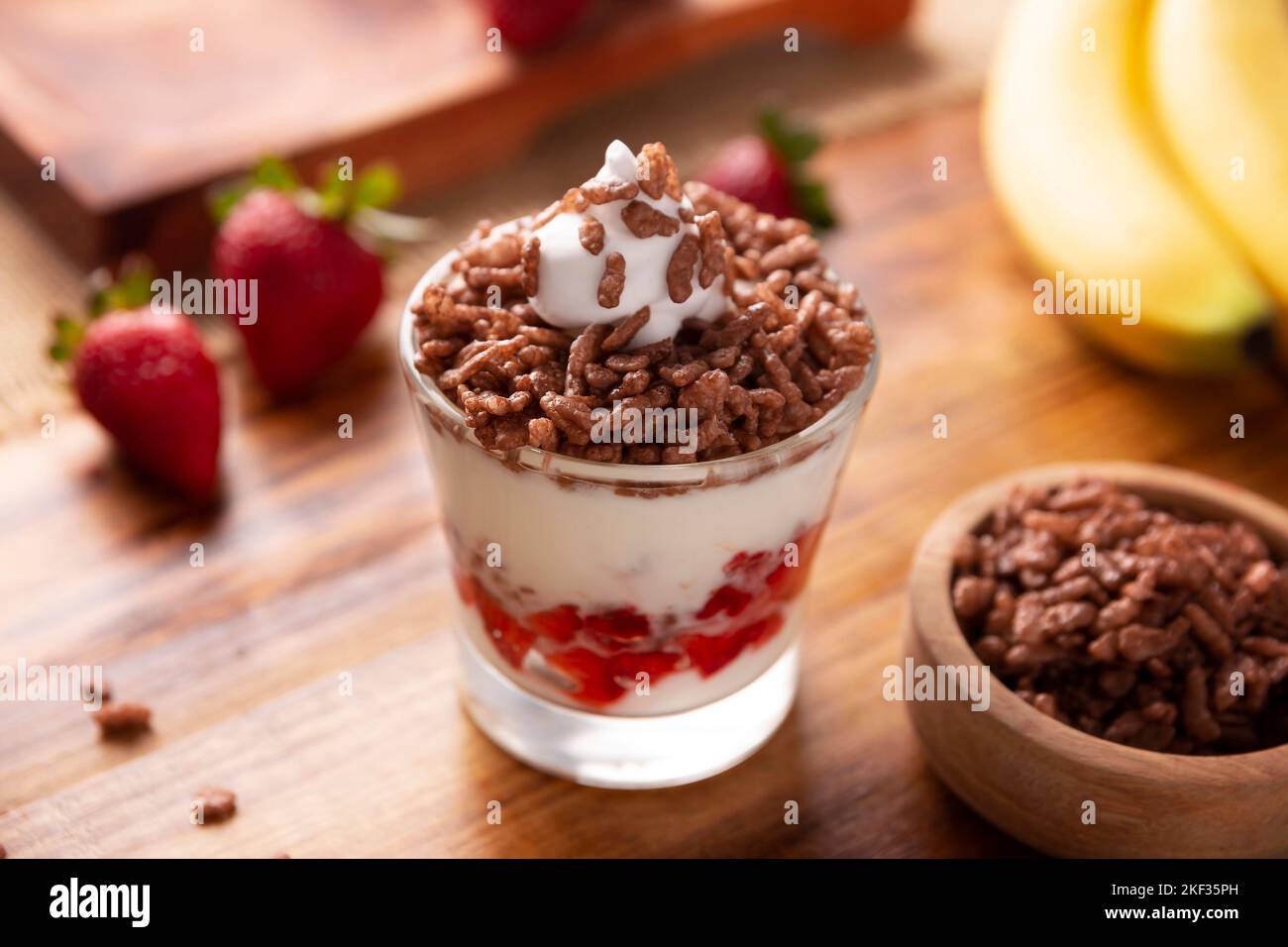 Healthy breakfast of Greek yogurt with fresh fruits and chocolate