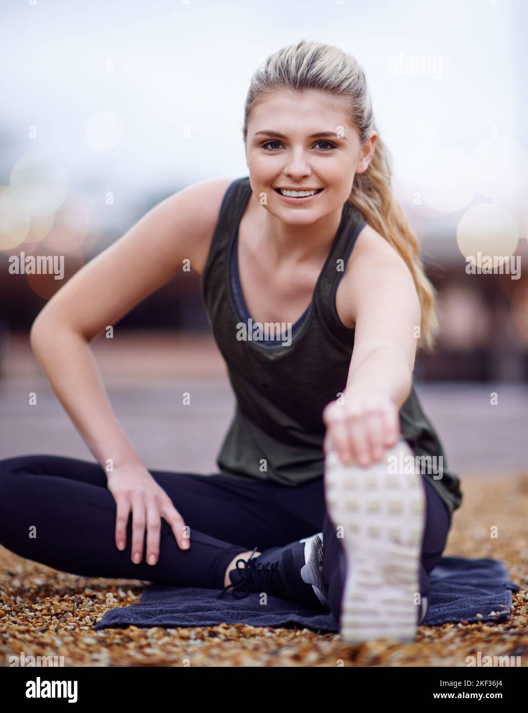Pretty woman stretching legs sitting hi-res stock photography and ...