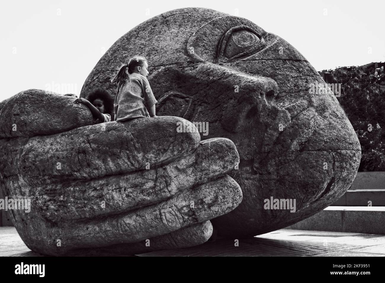 A giant stone head Écoute is a sculpture by French artist Henri de Miller in Paris. Stock Photo