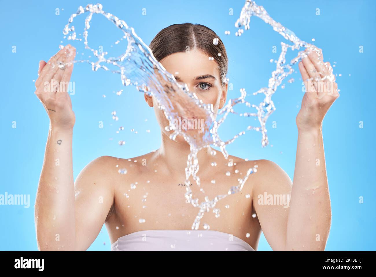 Water splash, woman and skincare beauty for skin health, wellness and