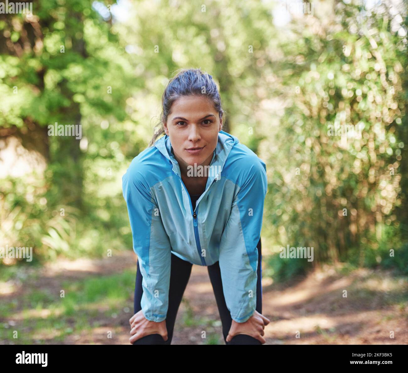 Catching my breath for the stretch. Portrait of a woman taking a