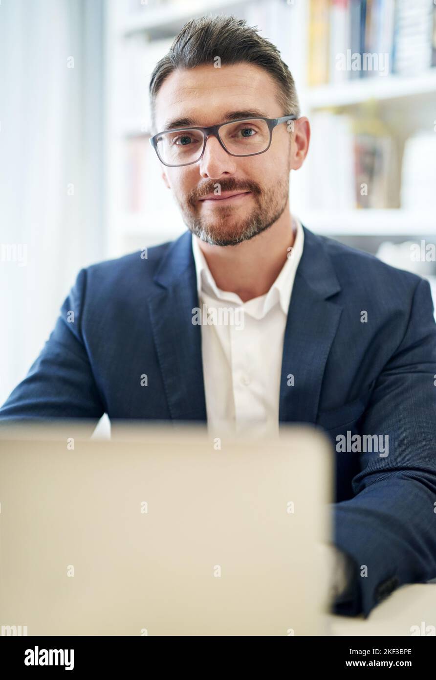 Tackling his work with a can-do attitude. Cropped portrait of a businessman working in his office. Stock Photo