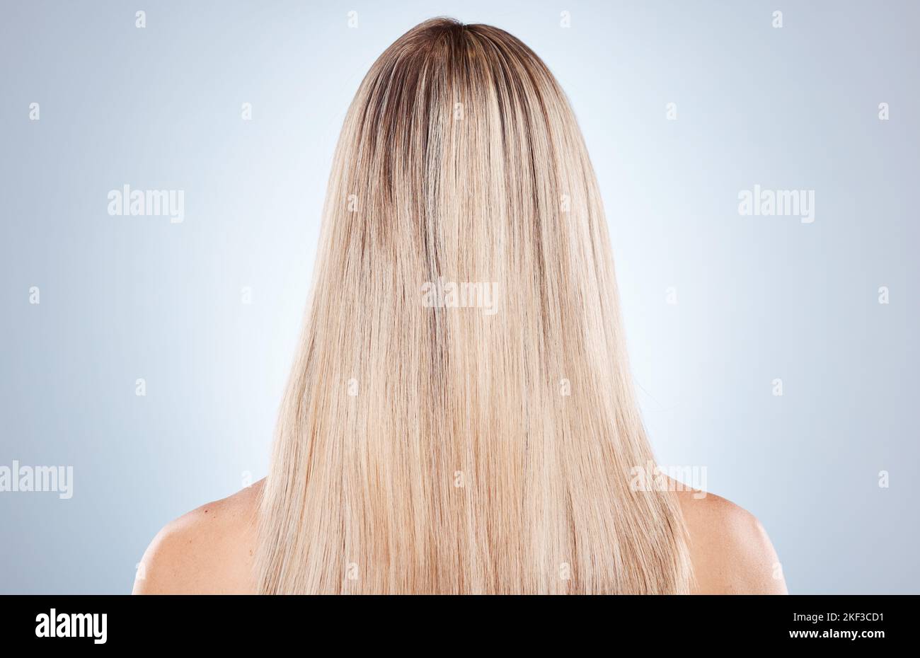 Hair care, woman and back for natural beauty, keratin and luxury against grey studio background. Mockup, female and lady with smooth hair, texture and Stock Photo