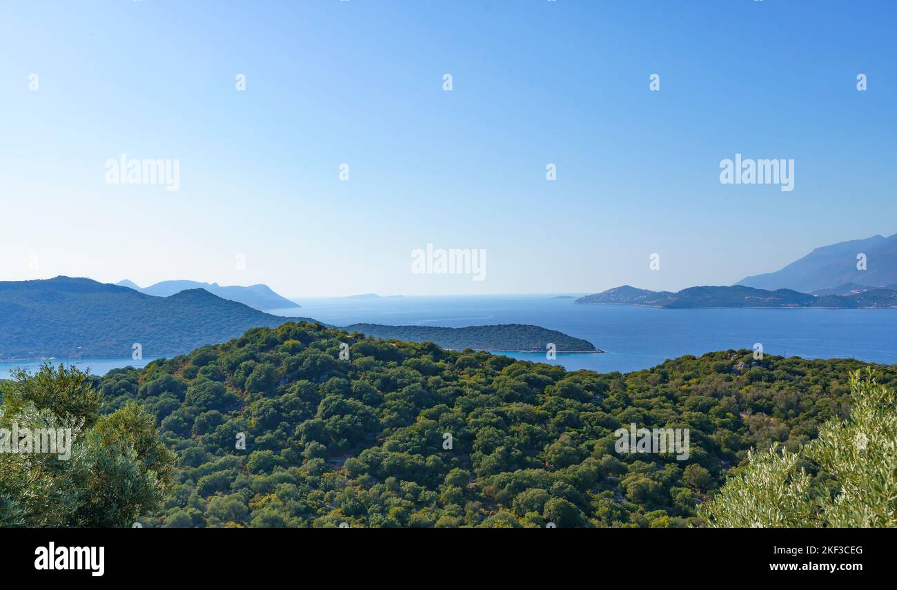 Natural landscape with hills and sea on a summer day. Mediterranean sea with islands and olive plantations on the hills. High quality photo Stock Photo