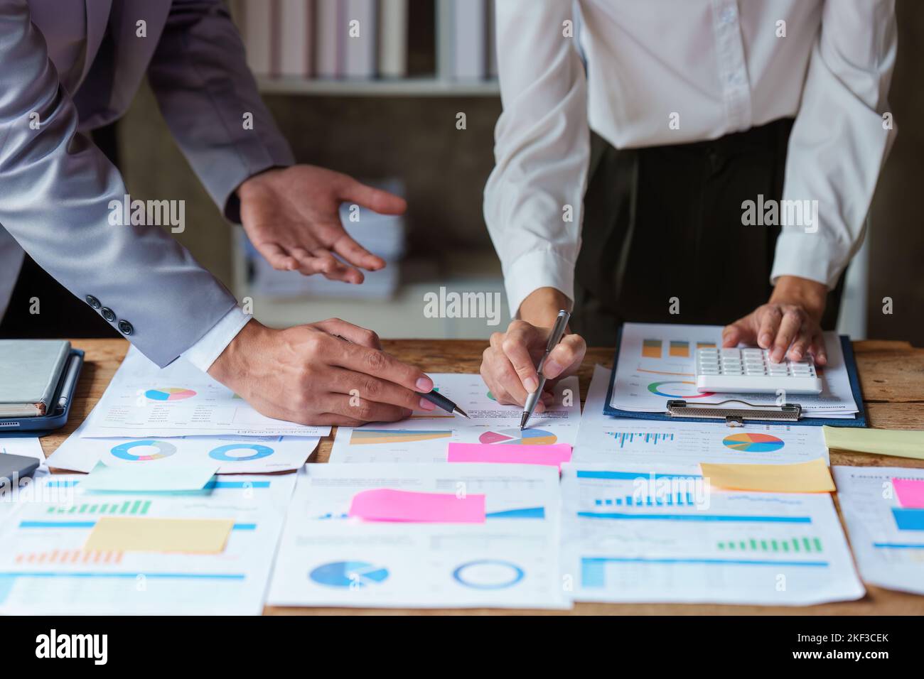Business people brainstorming data target financial on financial document paperwork. business finance and discuss concept Stock Photo