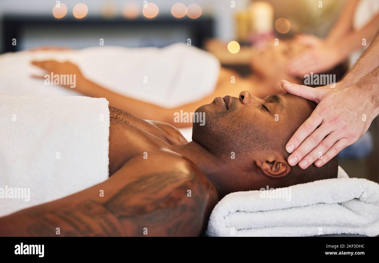Relax, spa and head massage with couple together for health, beauty and zen therapy. Luxury, wellness and peace with hands of massage therapist and Stock Photo
